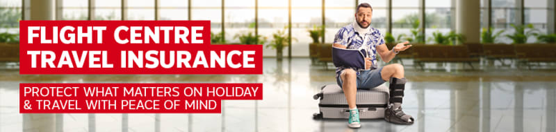 Flight Centre Travel Insurance | protect what matters on holiday & travel with peace of mind. Man with a broken neck, arm and leg sitting on a suitcase
