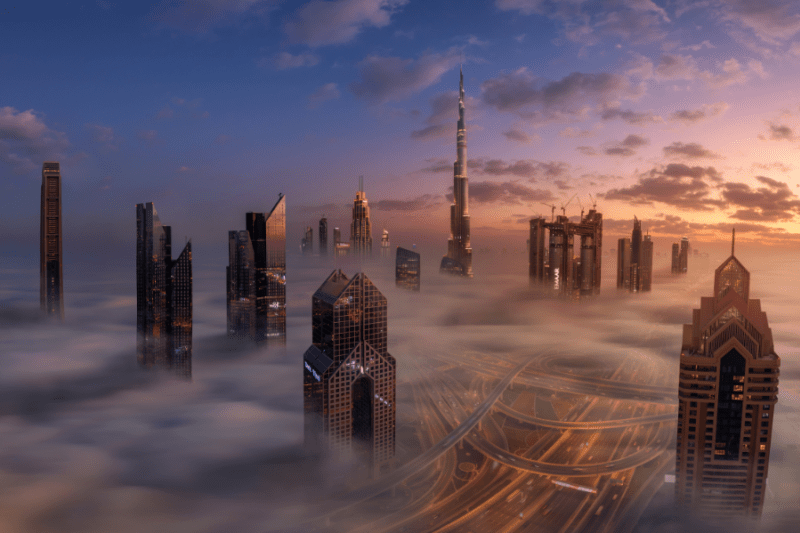 A low fog hangs beneath the Dubai cityscape