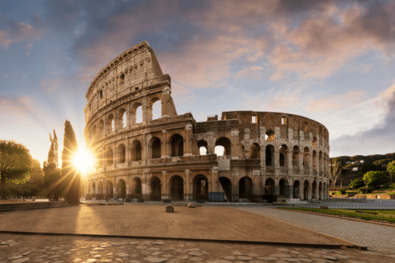 Sunlight through trees by the Colosseum